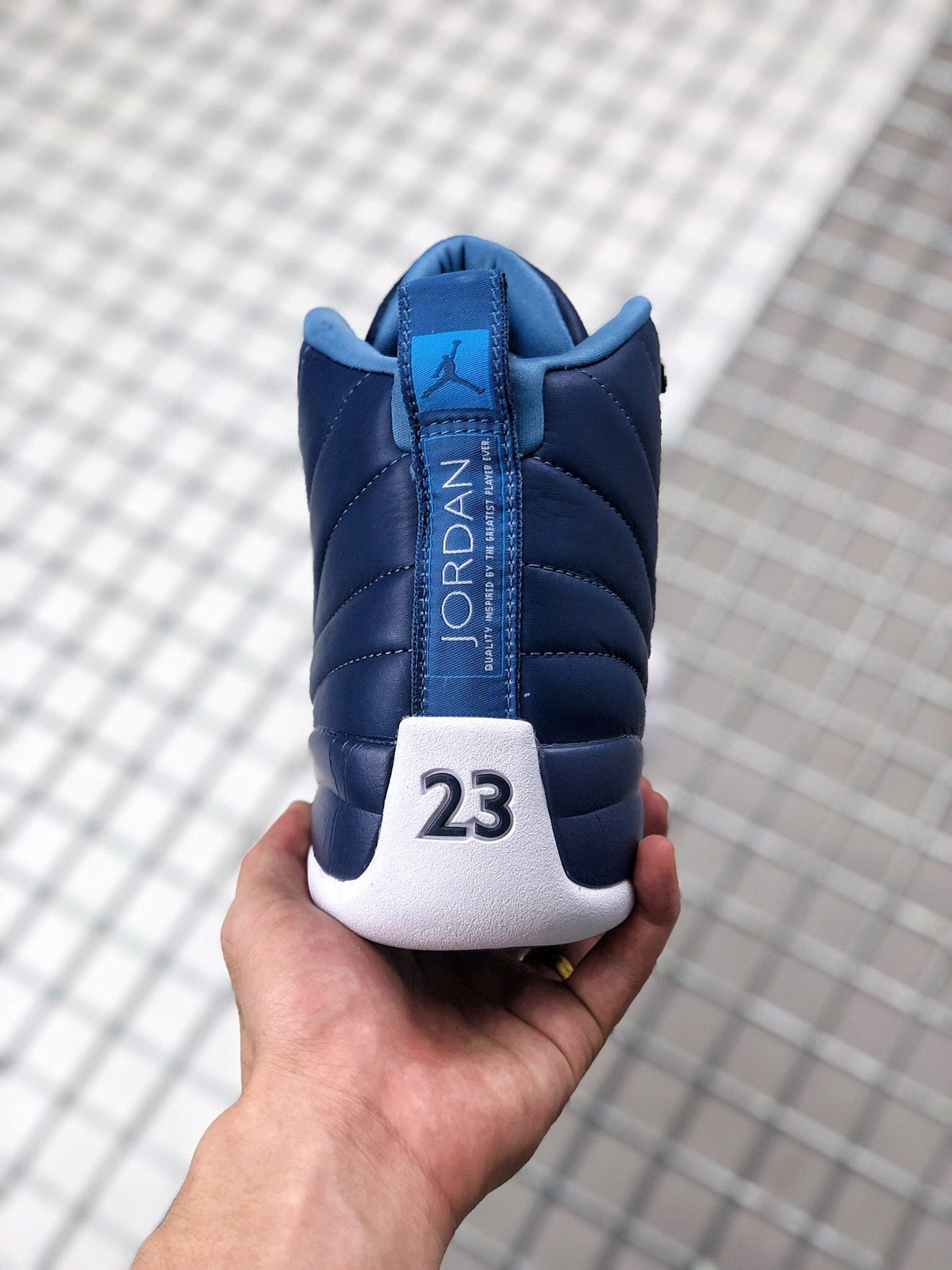Air Jordan 12 Indigo Sneakers 130690-404 - product image from the listing.