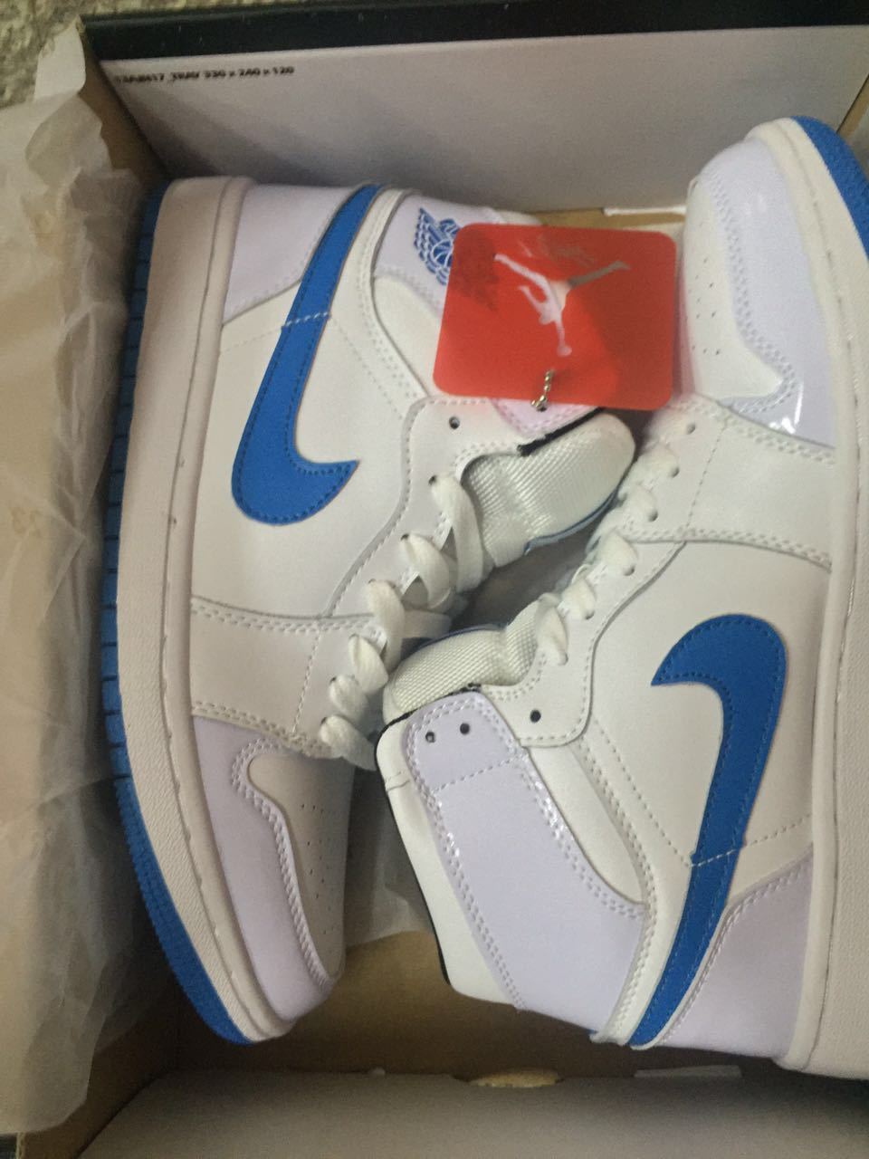 Air Jordan 1 High White and Royal Blue Sneakers - product image from the listing.