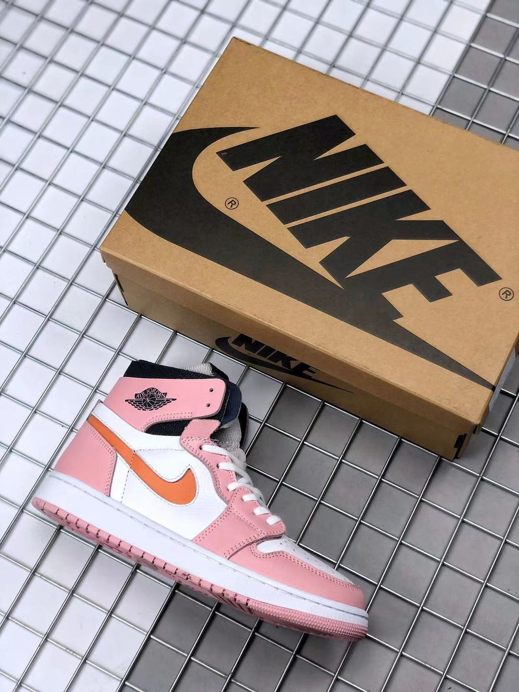 Jordan 1 High Zoom CMFT Sneakers in Pink White Orange CT0979-601 - product image from the listing.