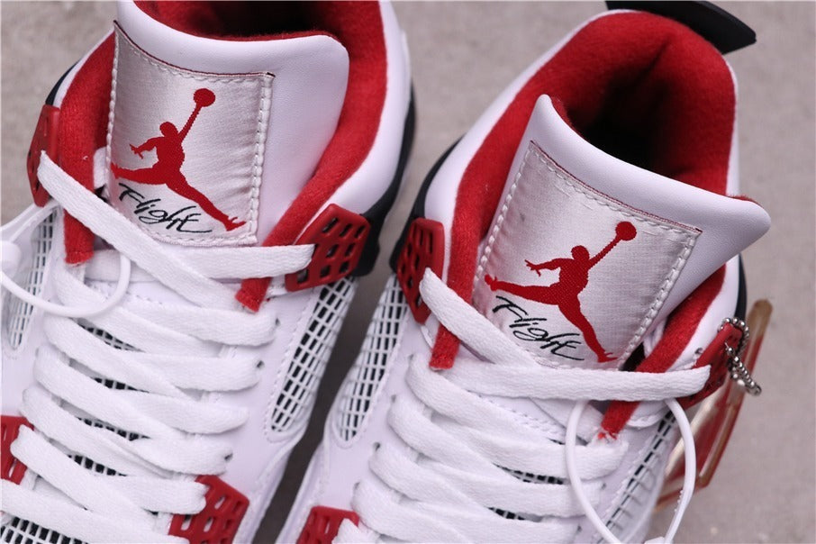 Air Jordan 4 Retro White Red Black Sneakers - product image from the listing.