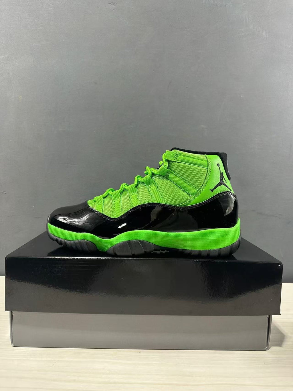 Air Jordan 11 Retro Sneakers in Black Green CT8012-310 - product image from the listing.