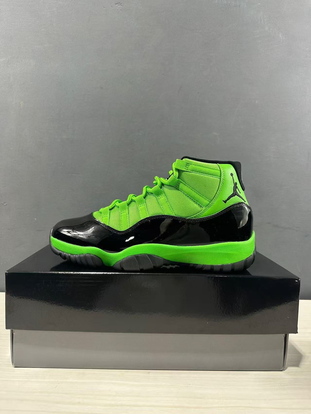Air Jordan 11 Retro Sneakers in Black Green CT8012-310 - product image from the listing.