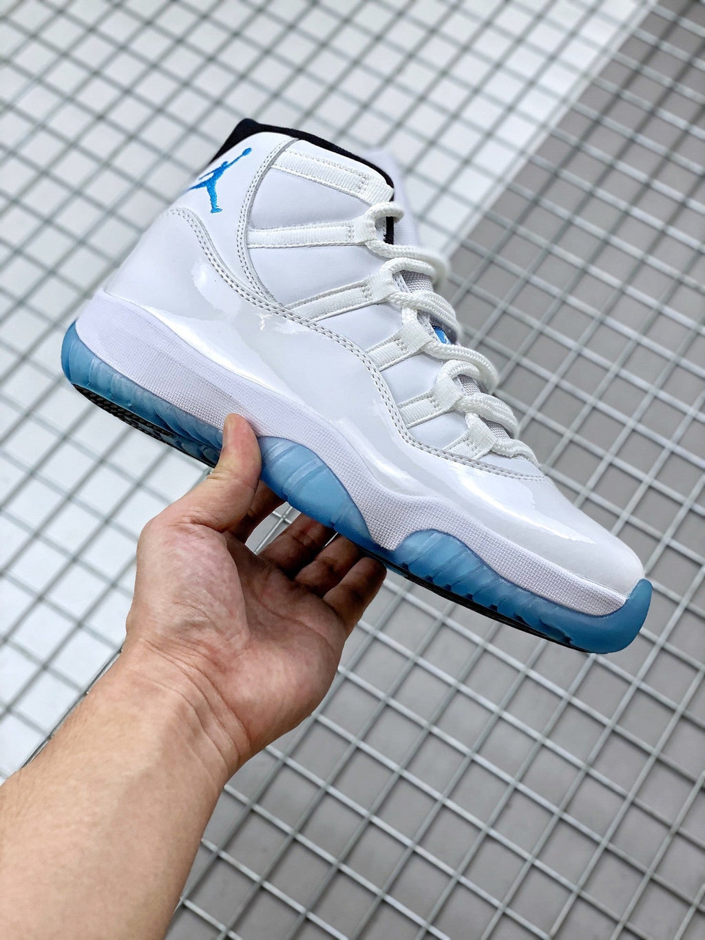 Jordan 11 Legend Blue Sneakers in White Blue 378037-117 - product image from the listing.