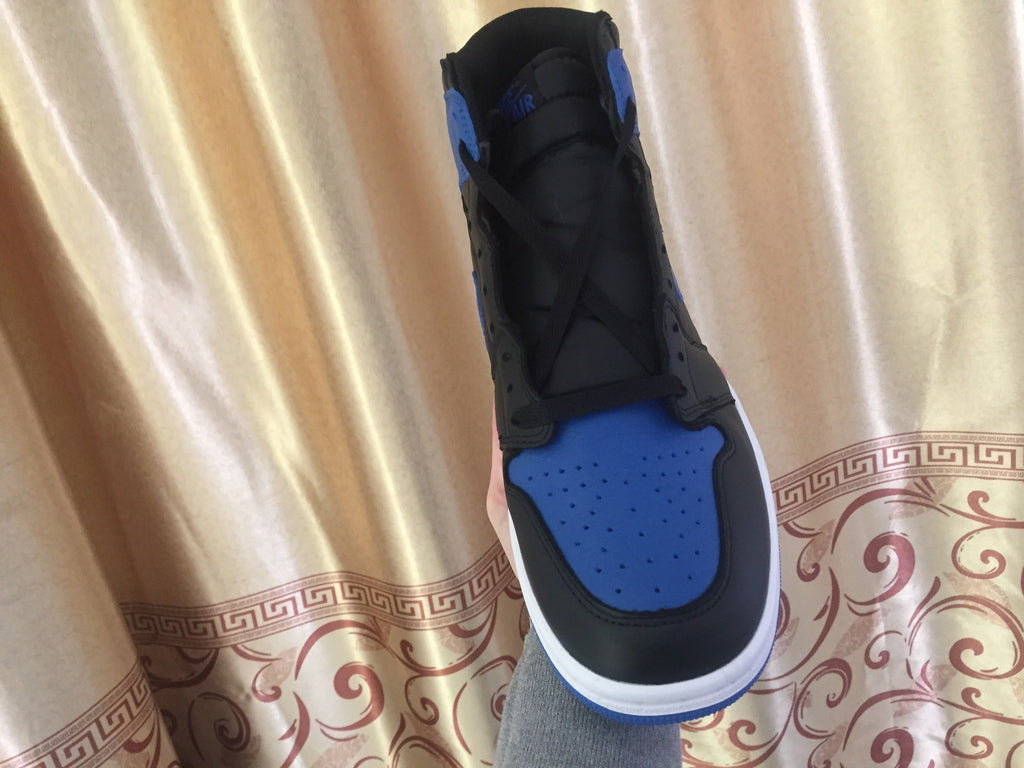 Jordan 1 High Sneakers in Black and Royal Blue - product image from the listing.