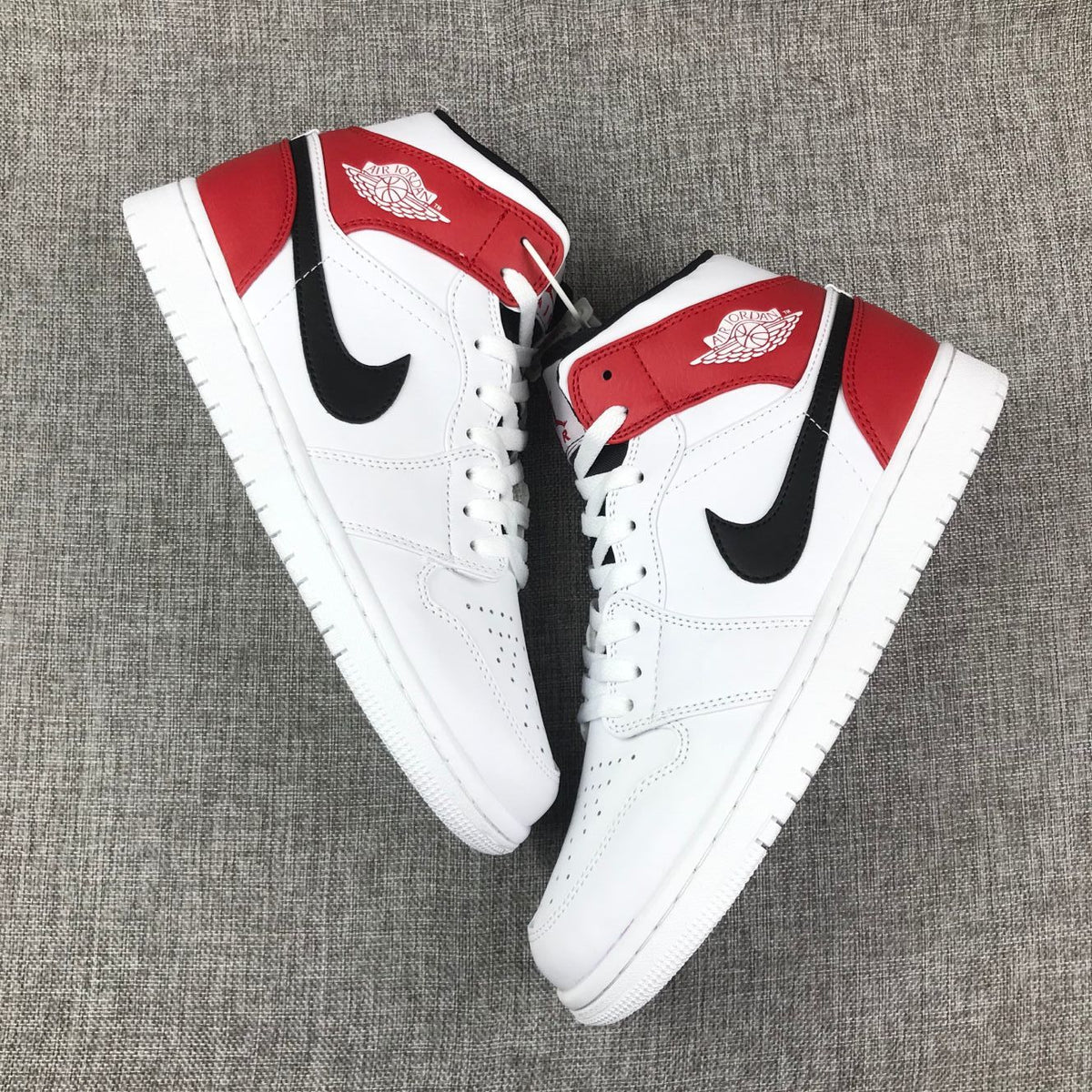Air Jordan 1 Mid Sneakers in White Red 554724-116 - product image from the listing.