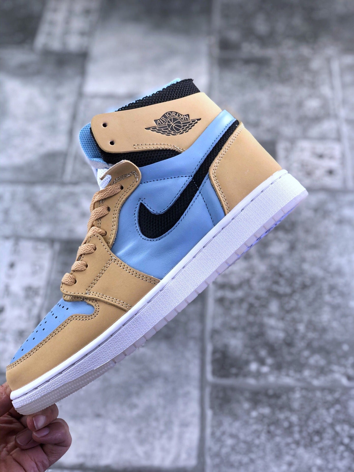 Air Jordan 1 Zoom CMFT Blue Tan Sneakers CT0979-400 - product image from the listing.