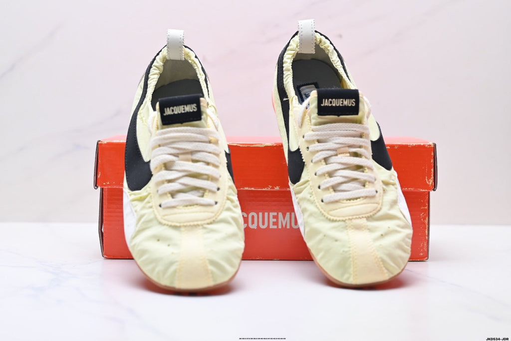 Jacquemus x Nike Jacumoon Sneakers, in Light Yellow and Black - product image from the listing.