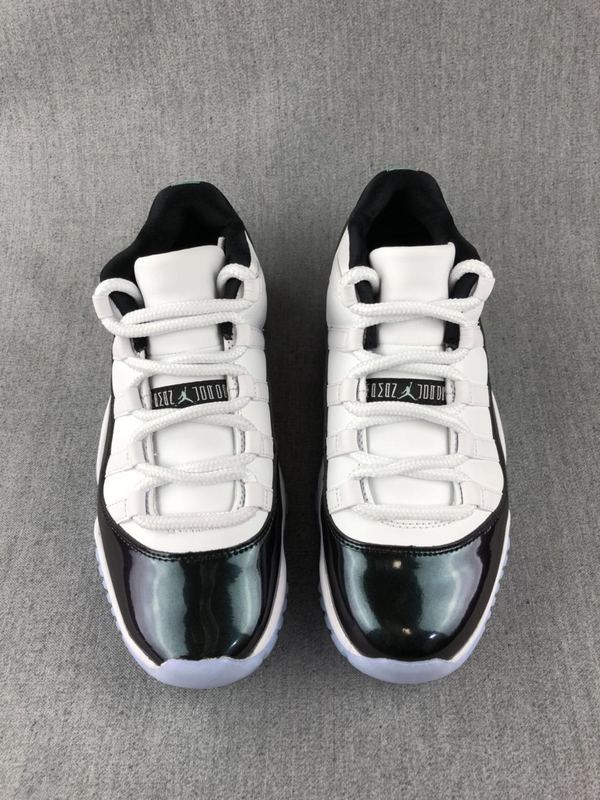 White and Black Jordan 11 Low Sneakers - product image from the listing.
