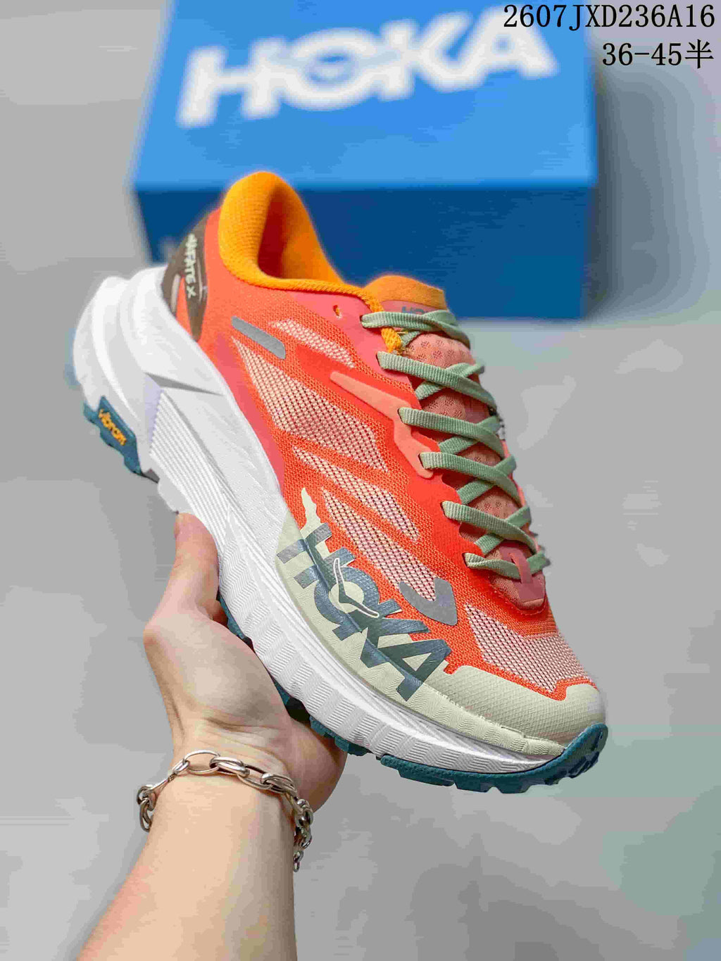 Hoka MAFATE X Trail Running Shoes in Coral and Yellow - product image from the listing.