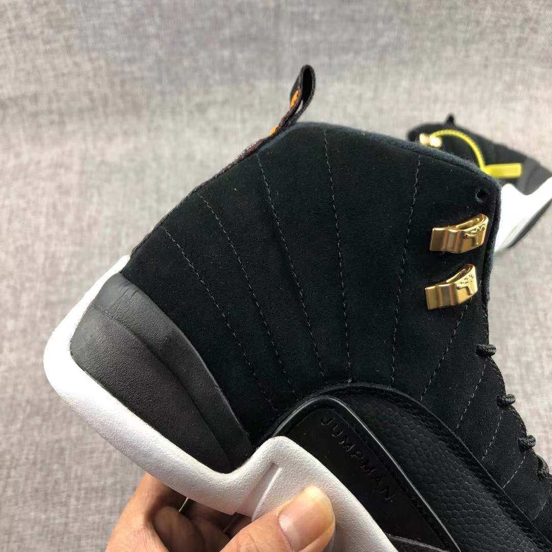 Air Jordan 12 Black Gold Sneakers 130690-017 - product image from the listing.