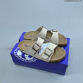 Two-Strap Slide Sandals by Birkenstock - product image from the listing.