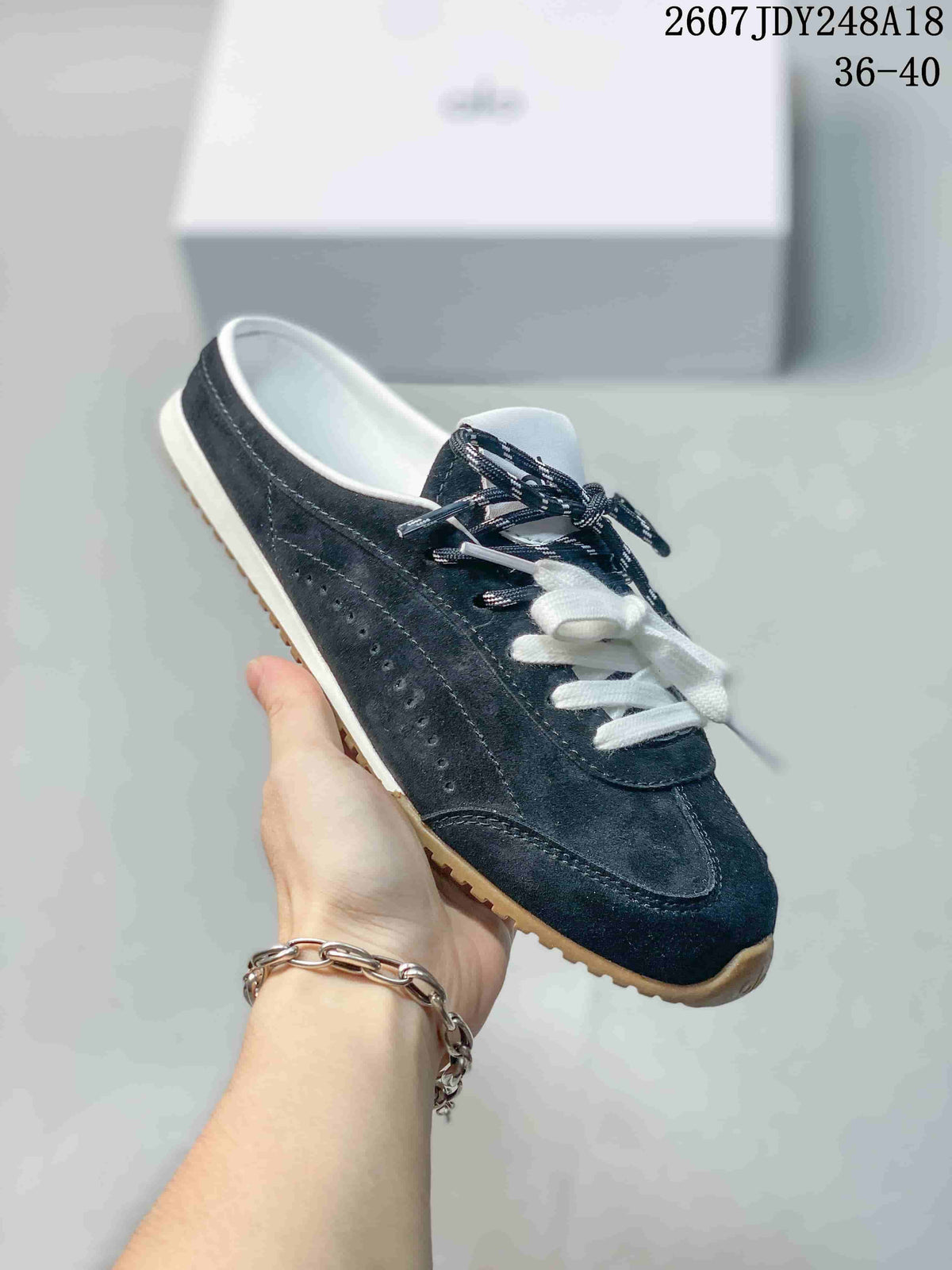 alo Sunset Mule Sneakers in Pink, in Navy and Cream - product image from the listing.