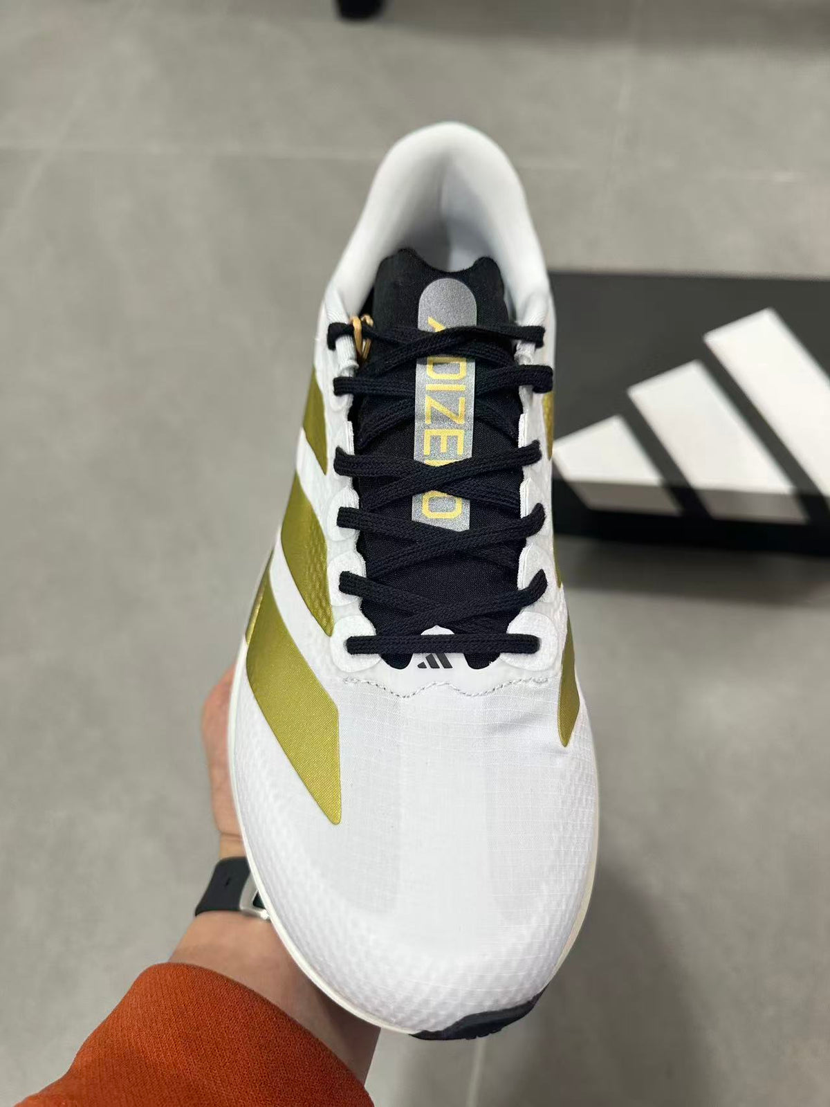 Adidas Lightstrike Pro Running Shoes in White Gold JQ4441 - product image from the listing.