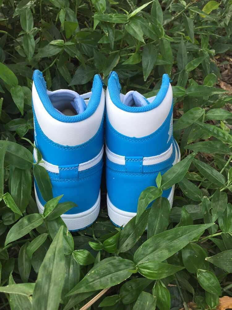 Blue and White Air Jordan 1 High Sneakers - product image from the listing.