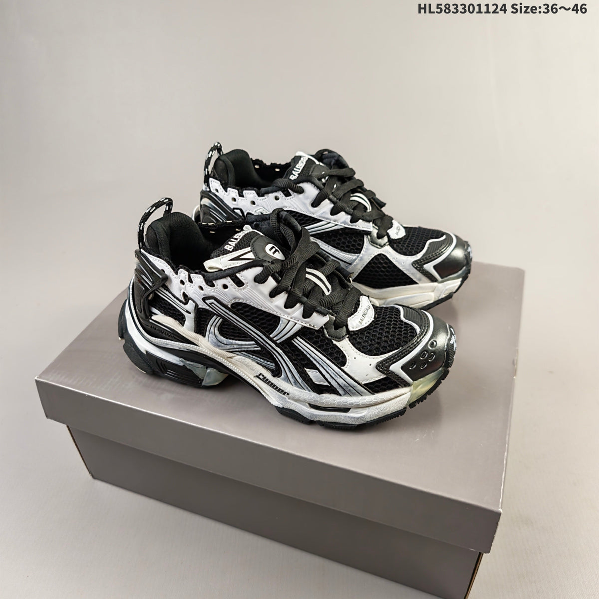 Black and White Balenciaga Runner Low-Top Sneakers - product image from the listing.