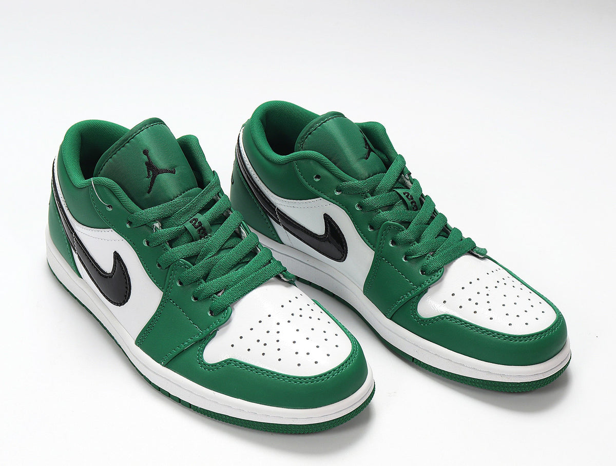 Jordan 1 Low Sneakers in White and Green 553558-301 - product image from the listing.