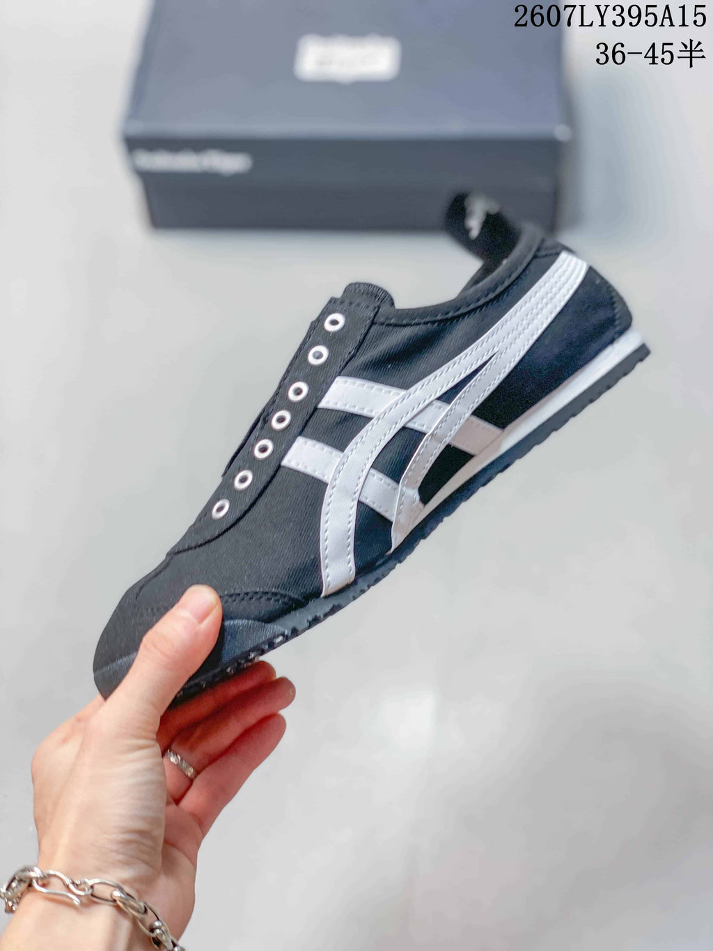 Onitsuka Tiger Mexico 66 Deluxe Sneakers in Black White 2607LY395A15 - product image from the listing.
