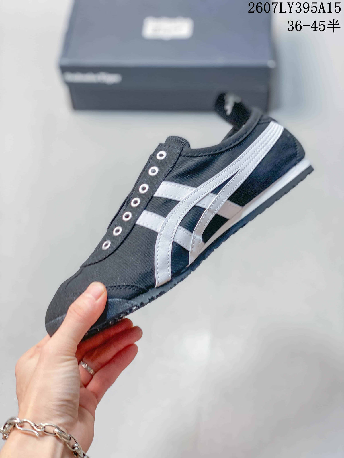 Onitsuka Tiger Mexico 66 Deluxe Sneakers in Black White 2607LY395A15 - product image from the listing.