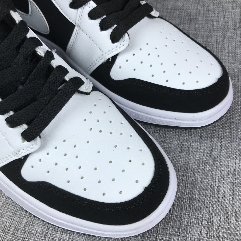 Air Jordan 1 Mid Black White Sneakers 554724-113 - product image from the listing.