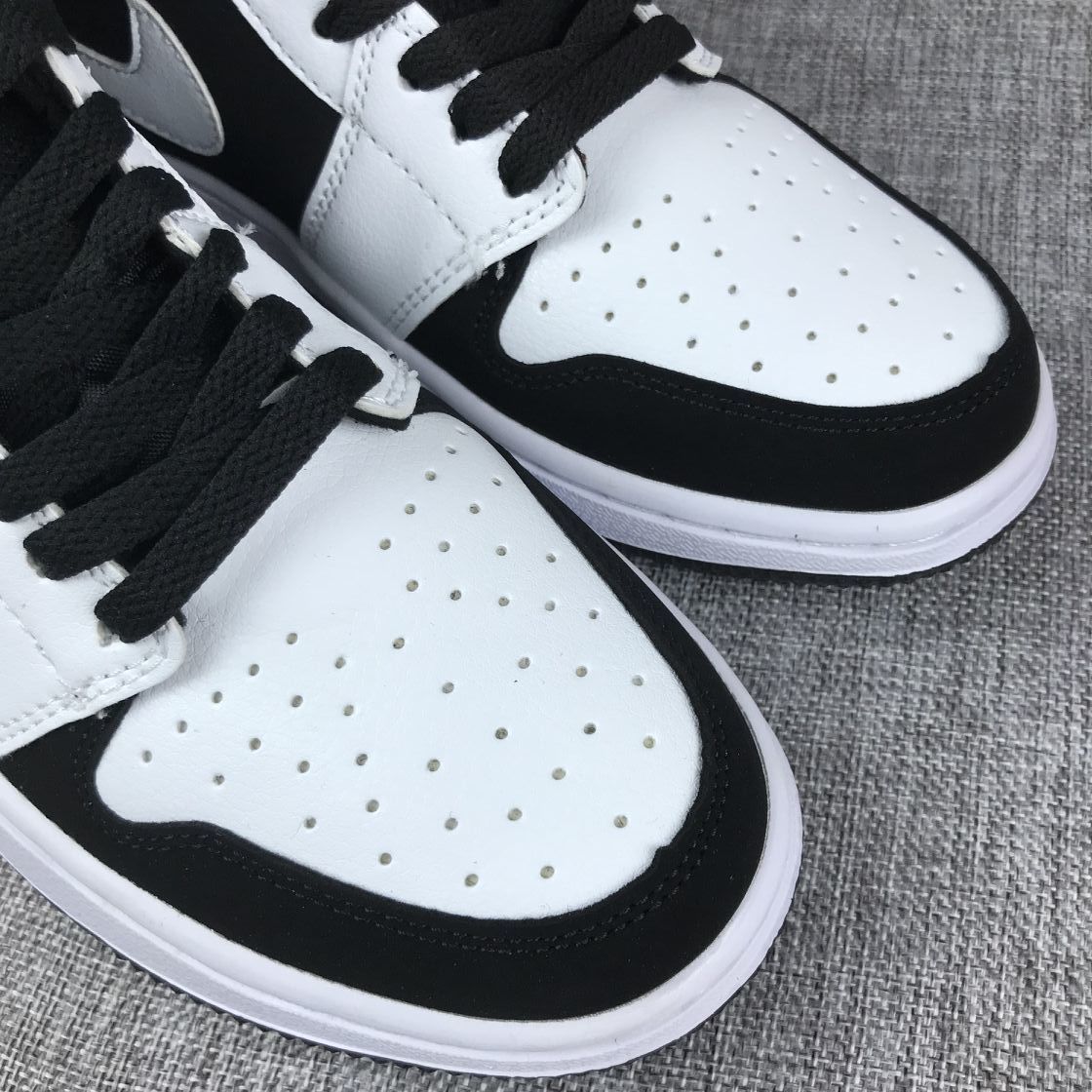 Air Jordan 1 Mid Black White Sneakers 554724-113 - product image from the listing.