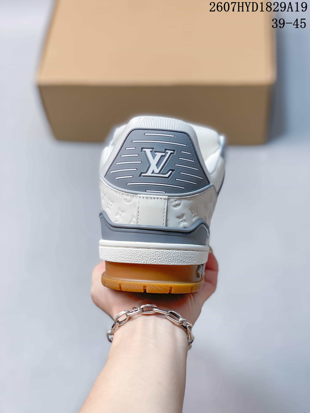 Louis Vuitton Trainer Maxi Low-Top Sneakers in White Gray - product image from the listing.