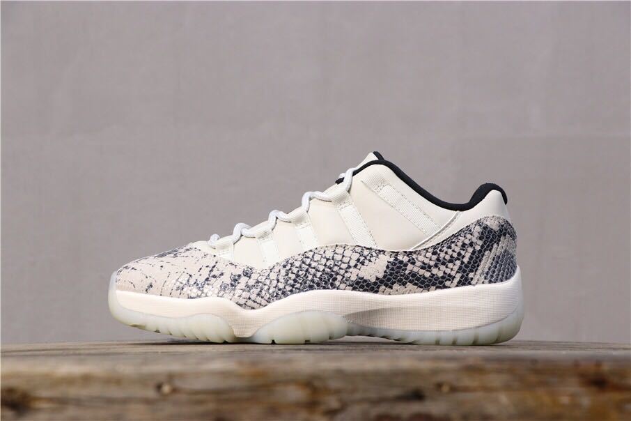 Air Jordan 11 Retro Low White Black Snakeskin Sneakers - product image from the listing.