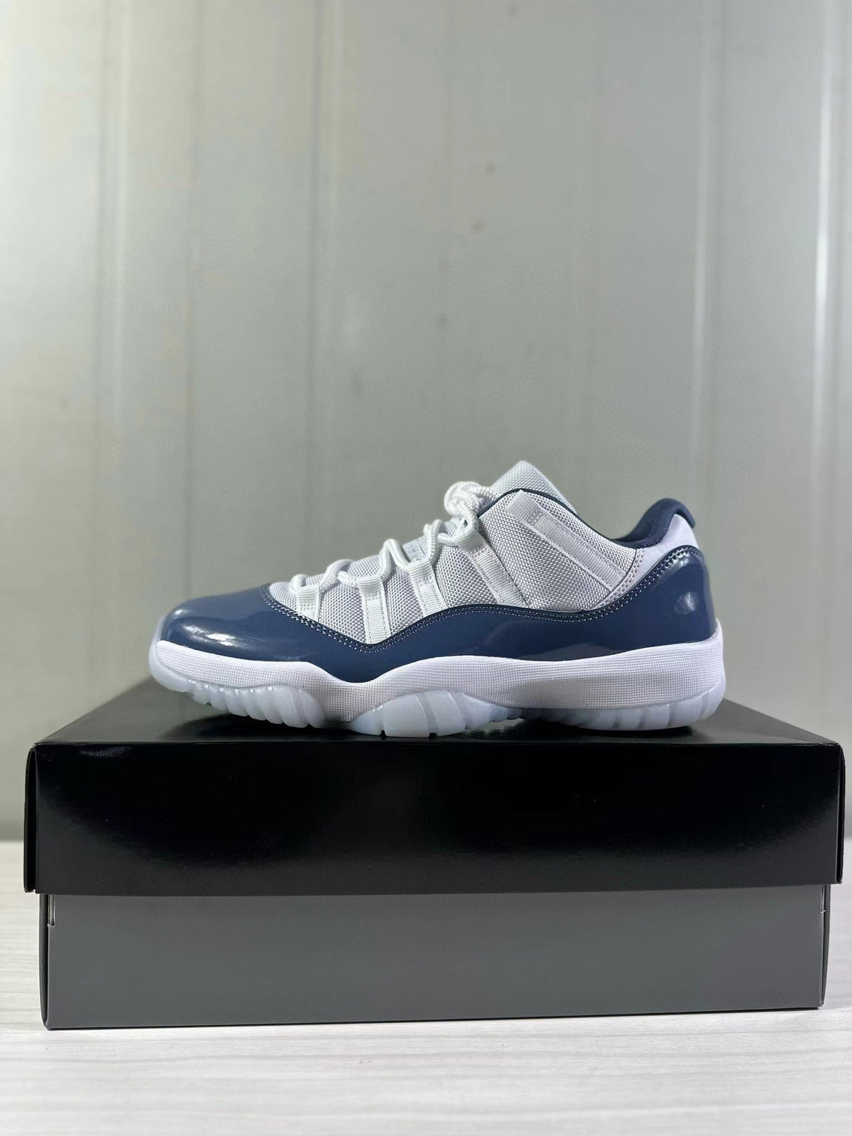 Air Jordan 11 Low Diffused Blue Sneakers FV5104-104 - product image from the listing.