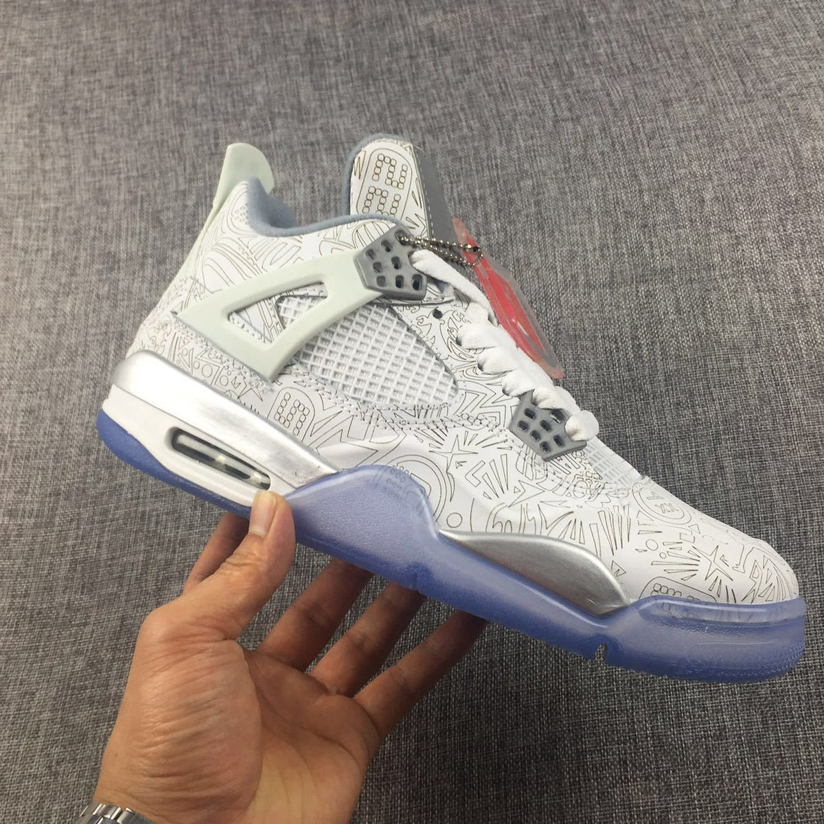 Air Jordan 4 Laser Platinum Sneakers - product image from the listing.