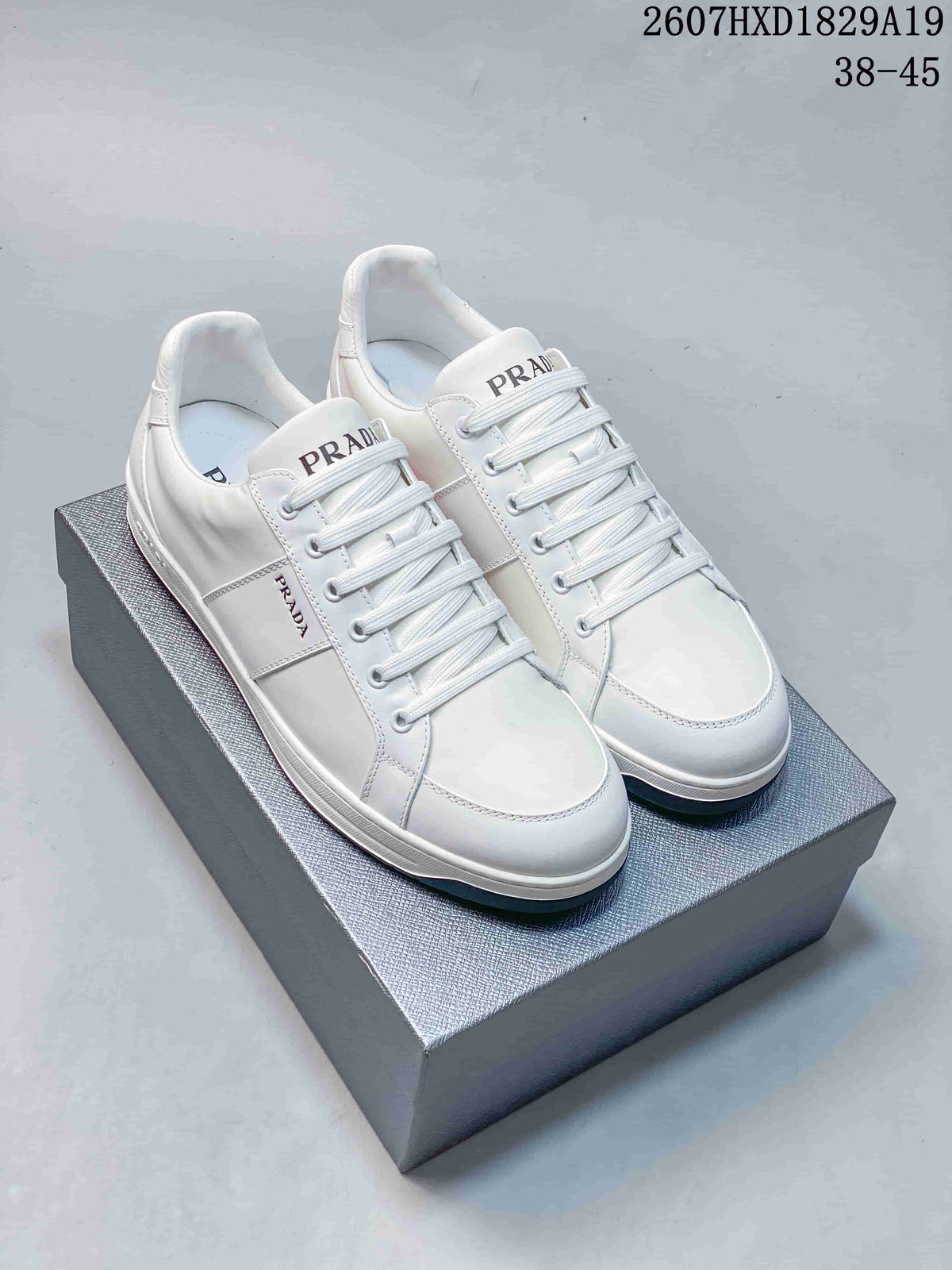 Prada Downtown Low-Top Sneakers in White Leather 2607HXD1829A19 - product image from the listing.