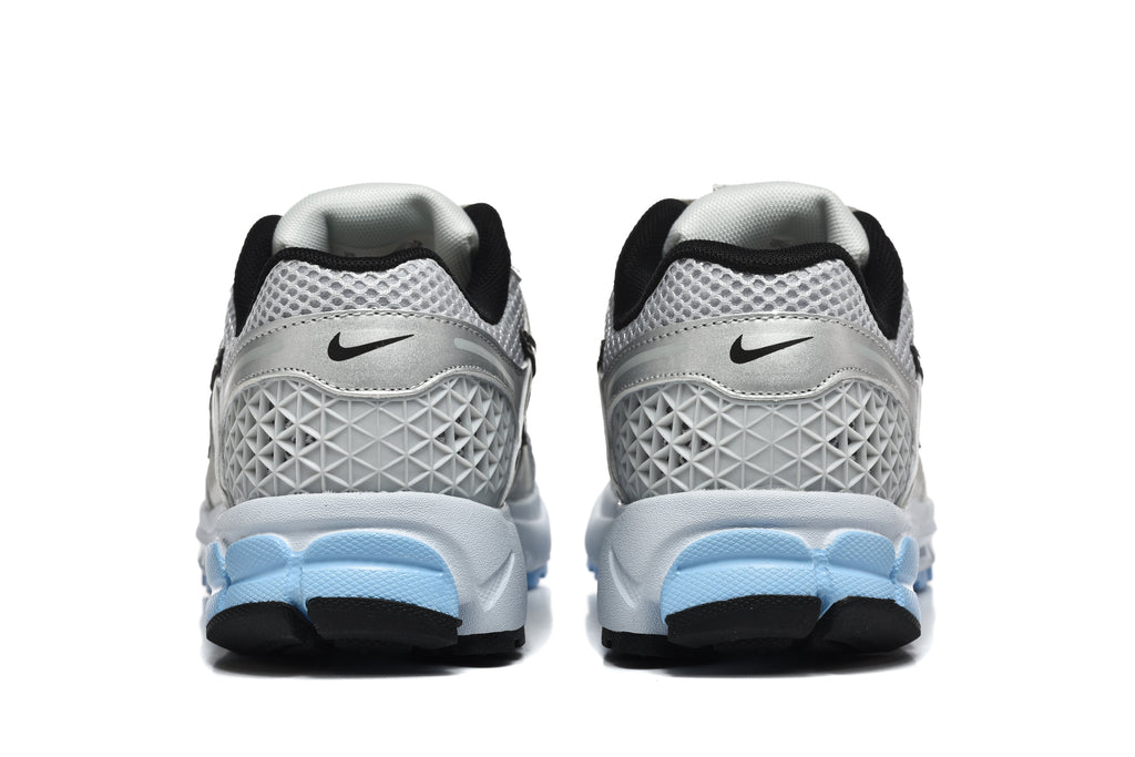 Nike Vomero 5 Sneakers in Silver and Light Blue - product image from the listing.