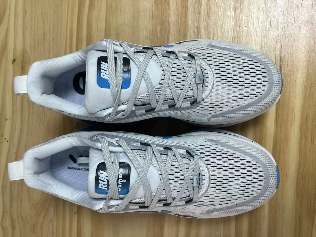 Nike Vomero 18 Running Shoes in White Blue - product image from the listing.