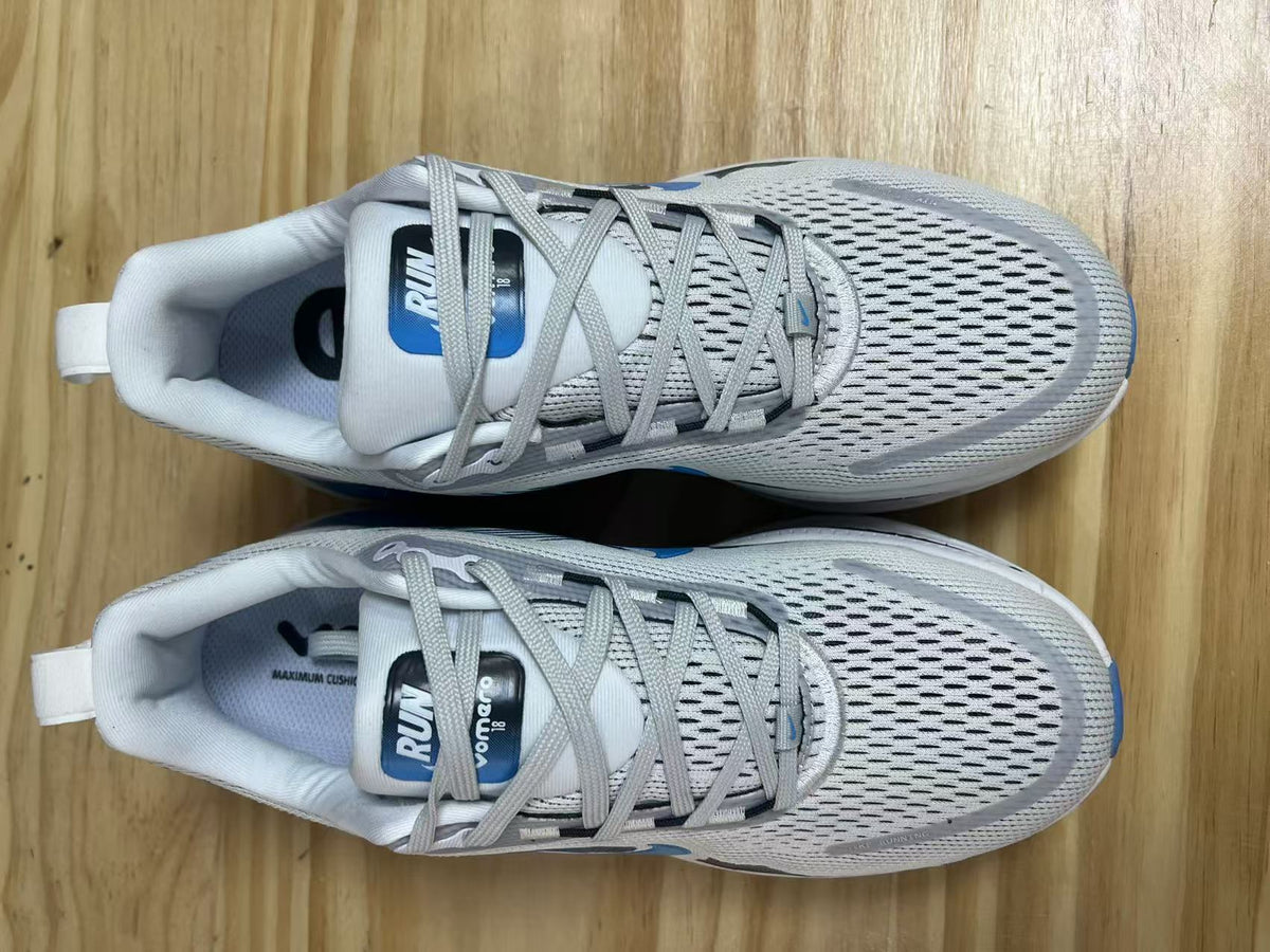 Nike Vomero 18 Running Shoes in White Blue - product image from the listing.