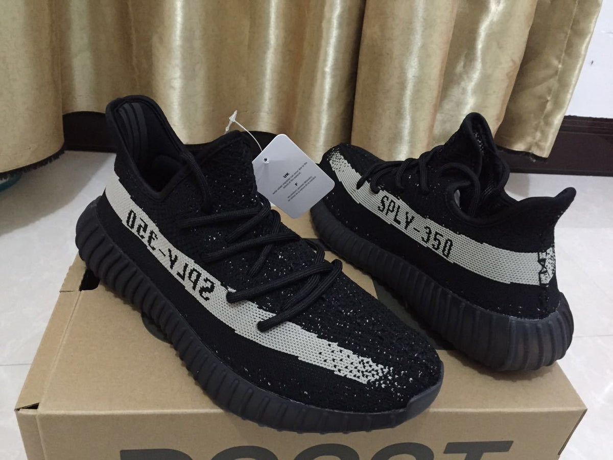Adidas Yeezy Boost 350 V2 Sneakers in Black White - product image from the listing.