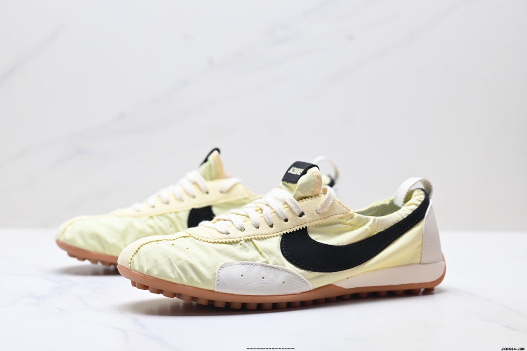 Jacquemus x Nike Jacumoon Sneakers, in Light Yellow and Black - product image from the listing.