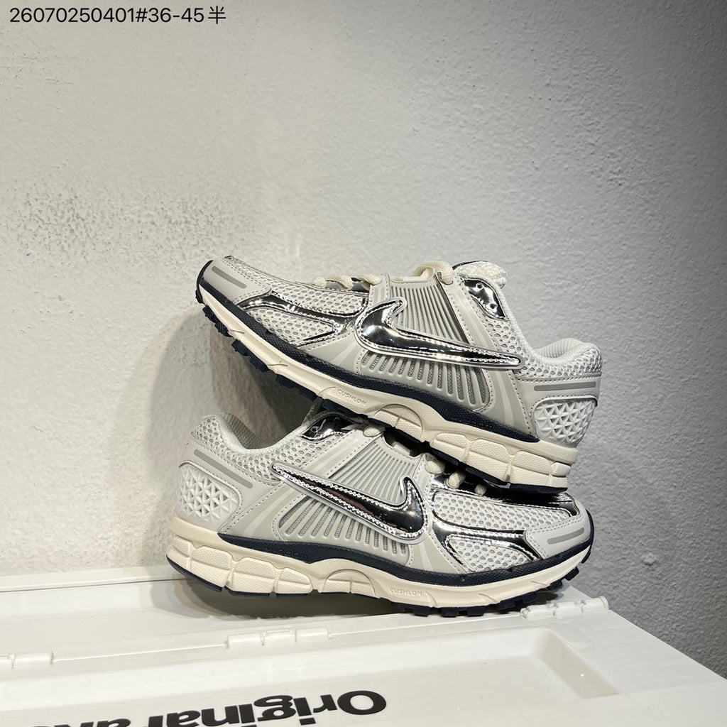 Nike Air Zoom Vomero 5 Sneakers, in White and Black - product image from the listing.