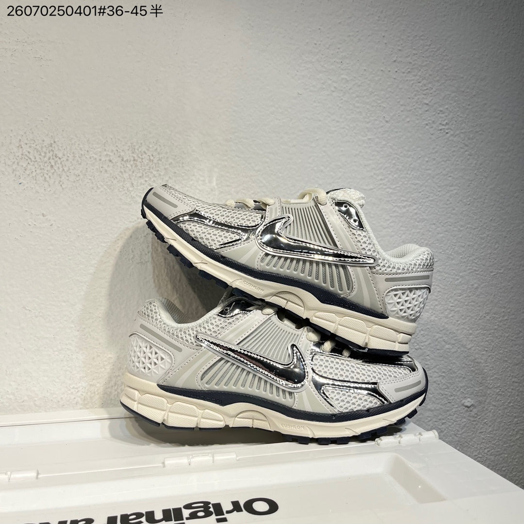 Nike Air Zoom Vomero 5 Sneakers, in White and Black - product image from the listing.