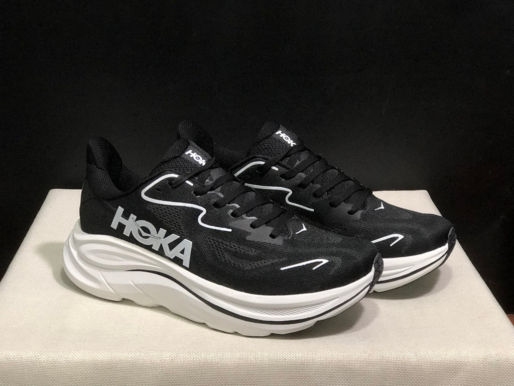 HOKA Clifton 10 Running Shoes in Black and White - product image from the listing.