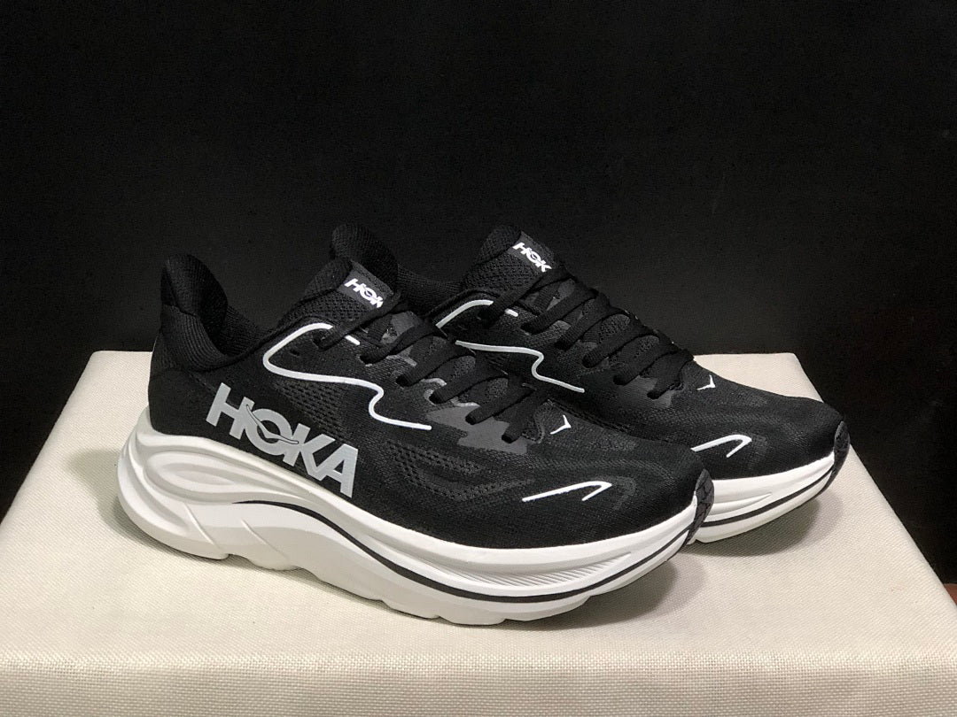 HOKA Clifton 10 Running Shoes in Black and White - product image from the listing.