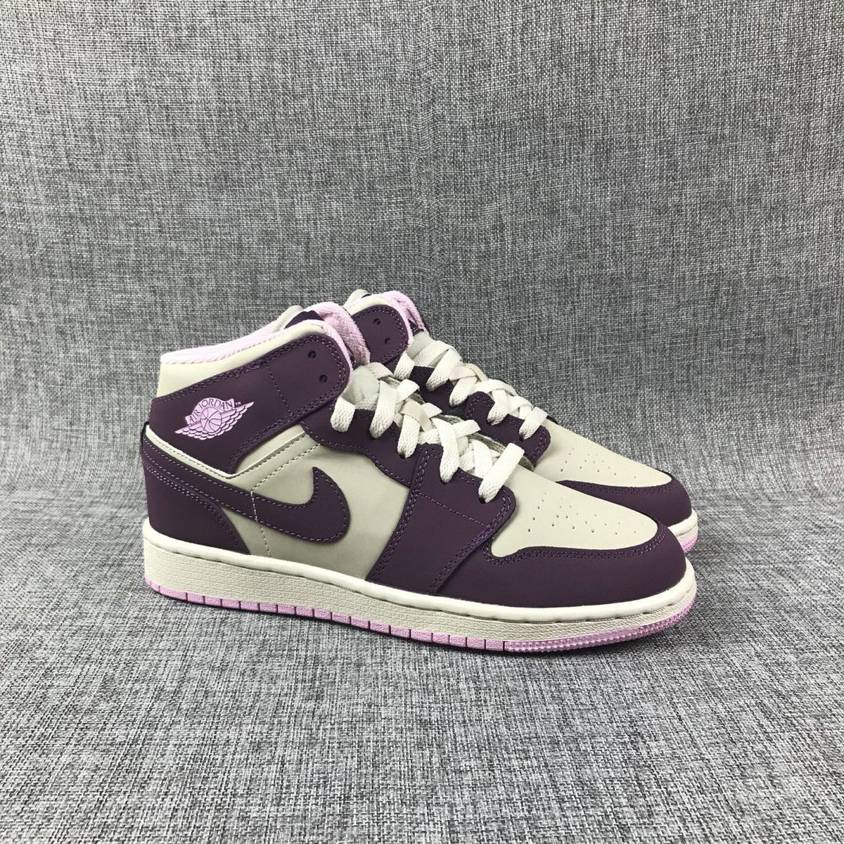 Air Jordan 1 Mid GS Sneakers in White Purple Pink - product image from the listing.