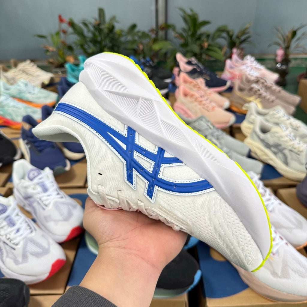 ASICS Novablast 5 LE Running Shoes in White Blue - product image from the listing.