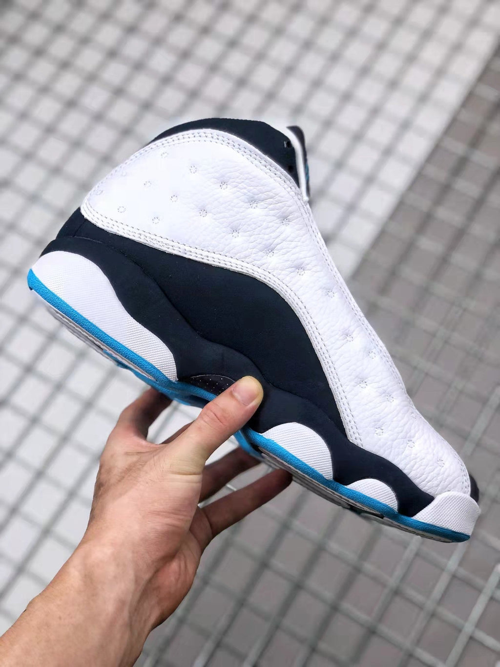 Air Jordan 13 Obsidian Sneakers 414571-144 - product image from the listing.