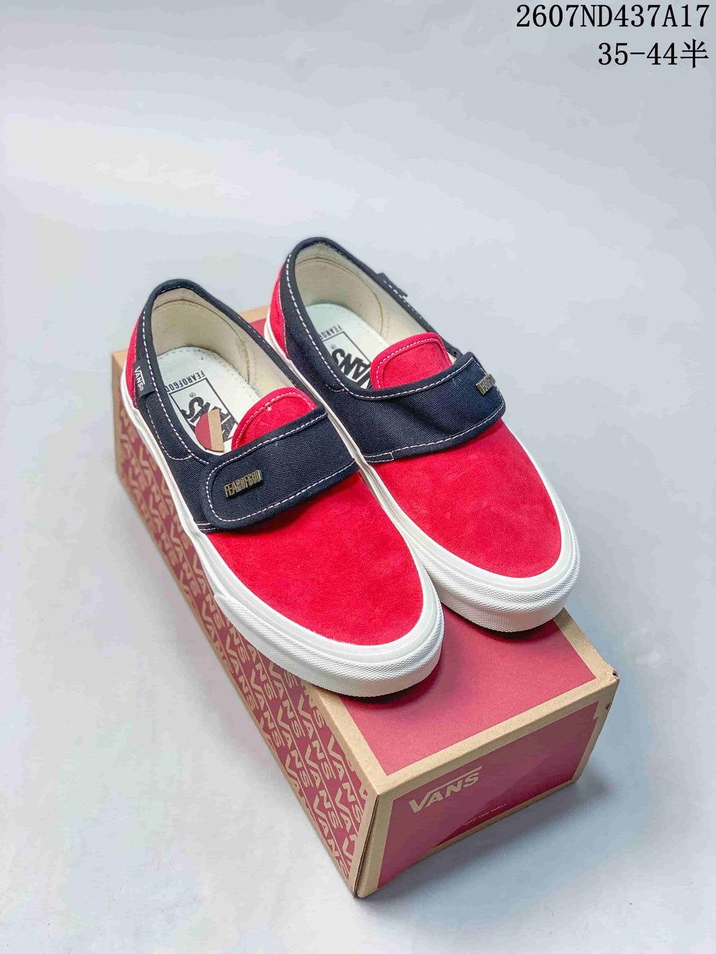 Vans Slip-On Trainers in Red/Navy and Checkerboard - product image from the listing.