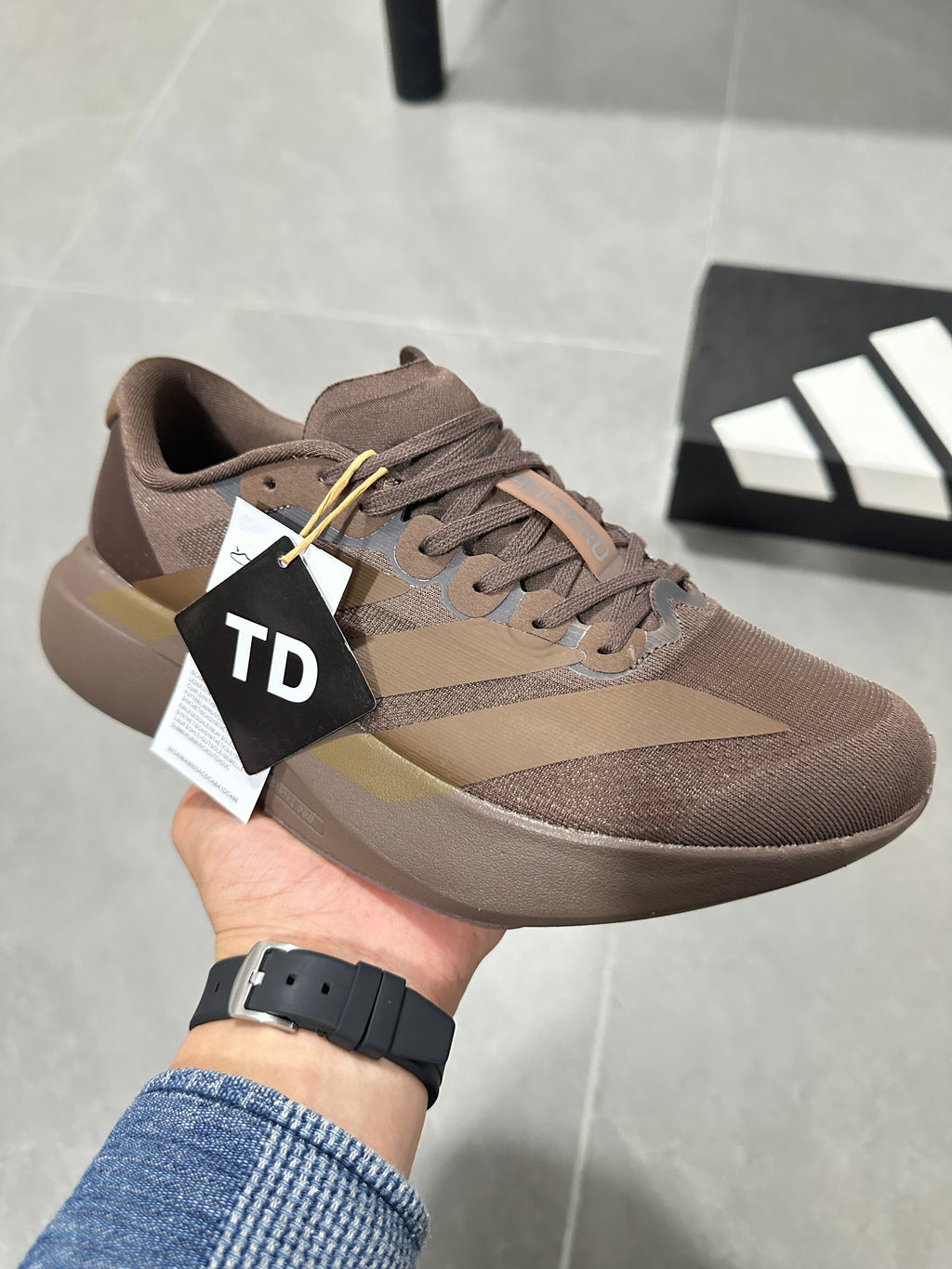 Brown and Tan Adidas Lightstrike Pro Running Shoes - product image from the listing.