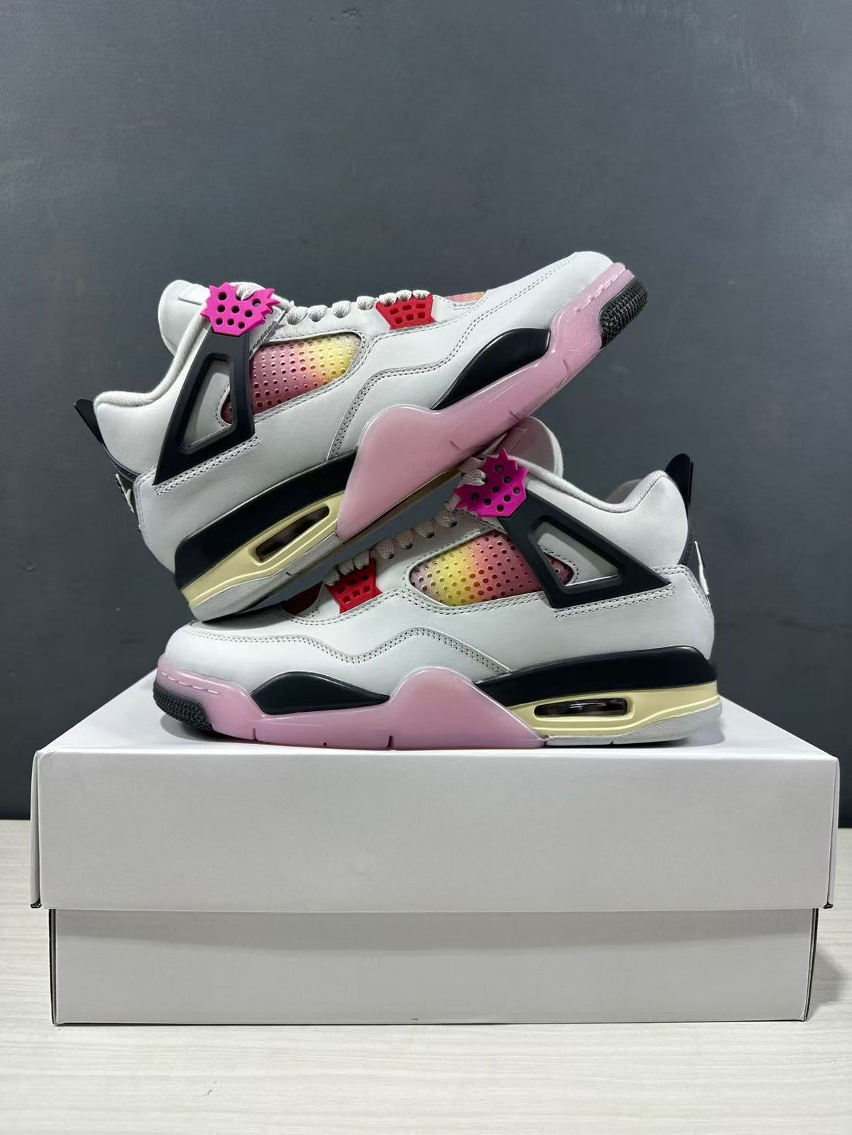 Air Jordan 4 Retro Comic Sneakers White Black Pink JA1135-100 - product image from the listing.