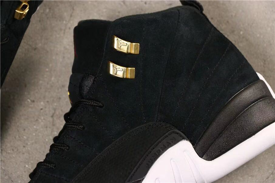 Air Jordan 12 Reverse Taxi Sneakers Black 153265-017 - product image from the listing.