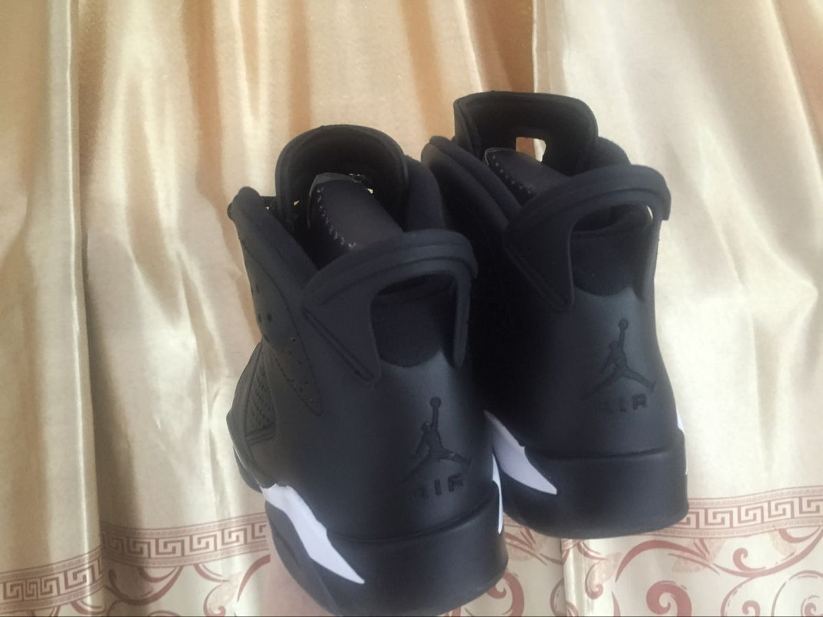 Jordan 6 Retro Black Cat High-Top Sneakers in Black and White - product image from the listing.