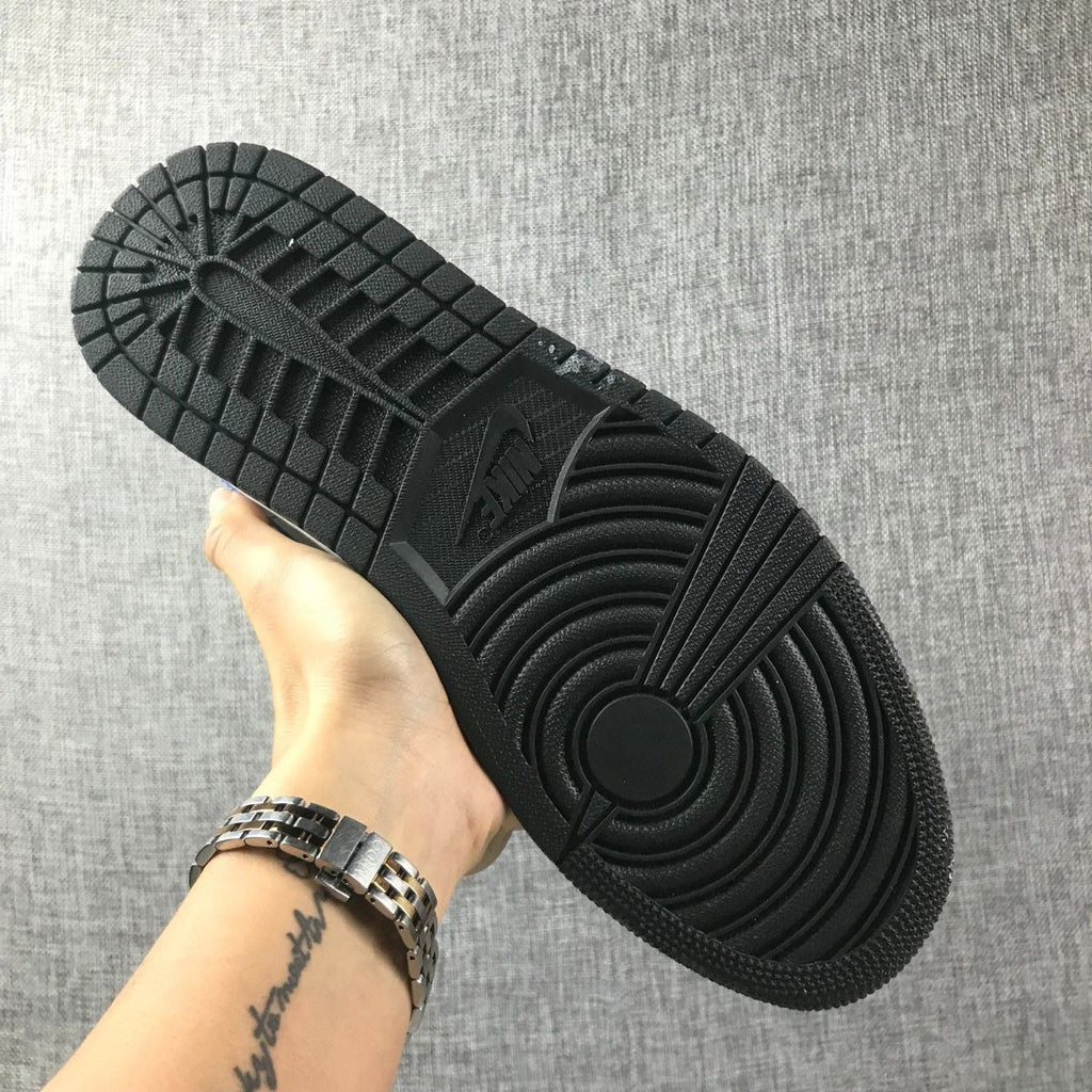 Air Jordan 1 Mid High-Top Sneakers in Black and Blue - product image from the listing.
