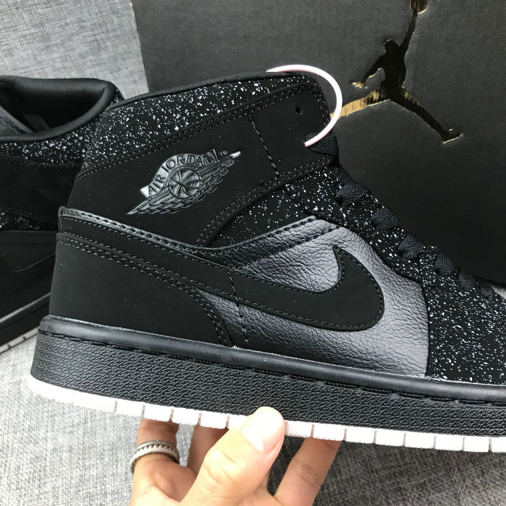 Air Jordan 1 Mid Black and White Sneakers 554724-001 - product image from the listing.