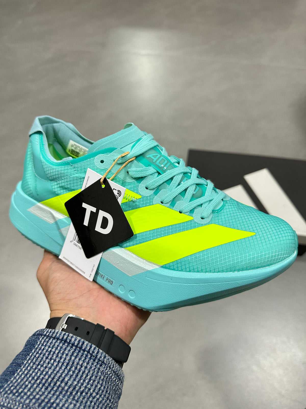 Aqua and Volt Nike Lightstrike Pro Running Shoes - product image from the listing.