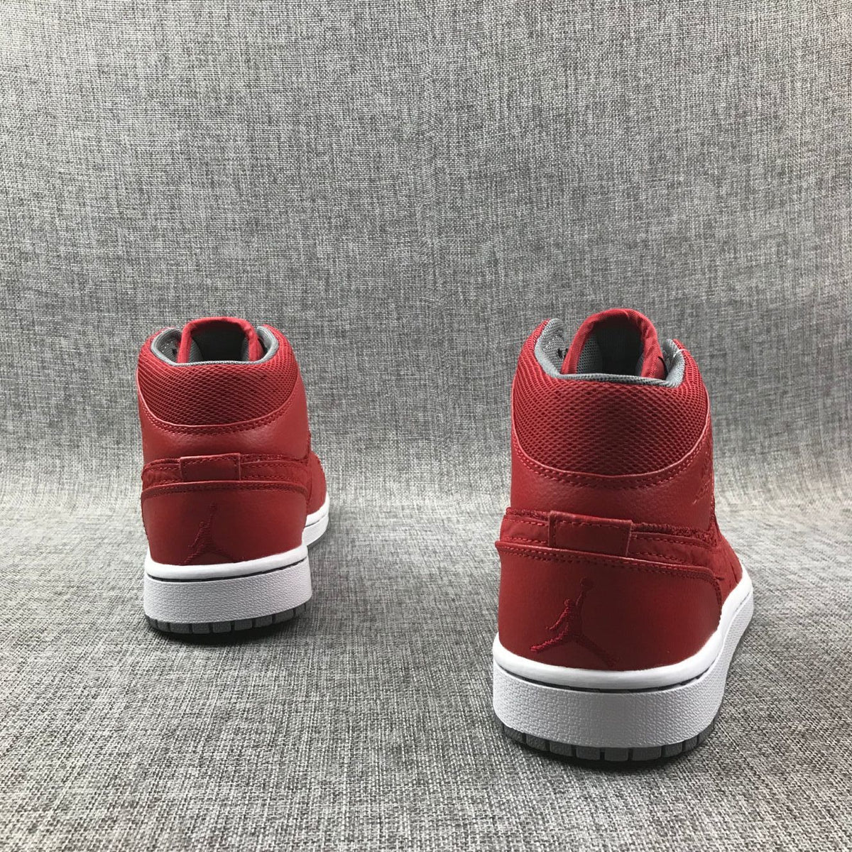 Red and Grey Jordan 1 Mid High-Top Sneakers - product image from the listing.